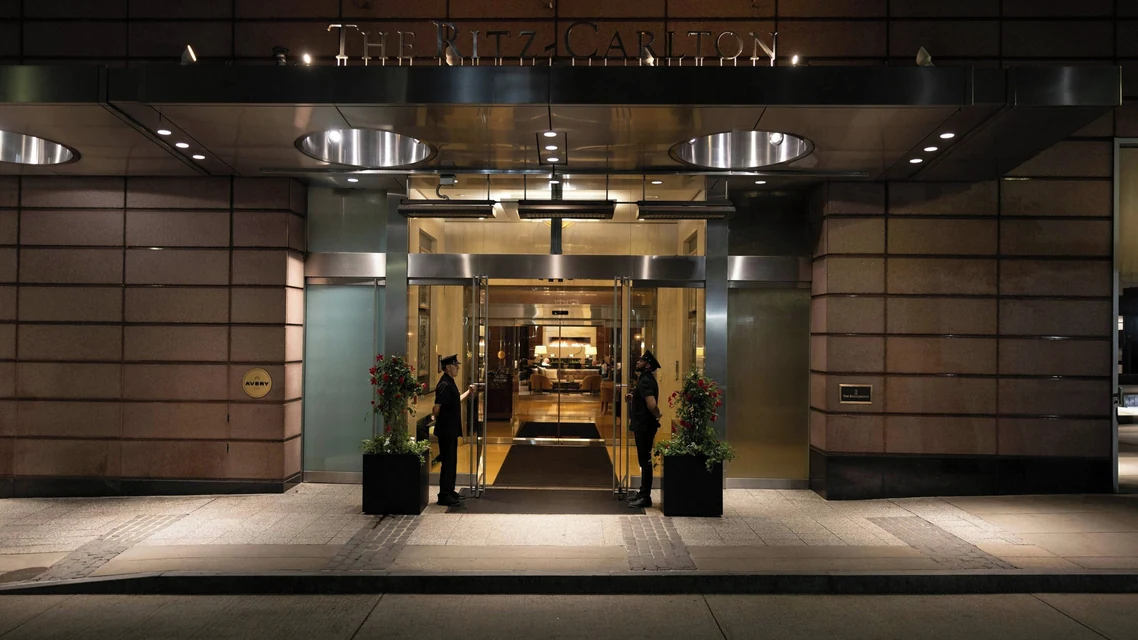The Ritz-Carlton, Boston entrance on Avery Street at night via Expedia