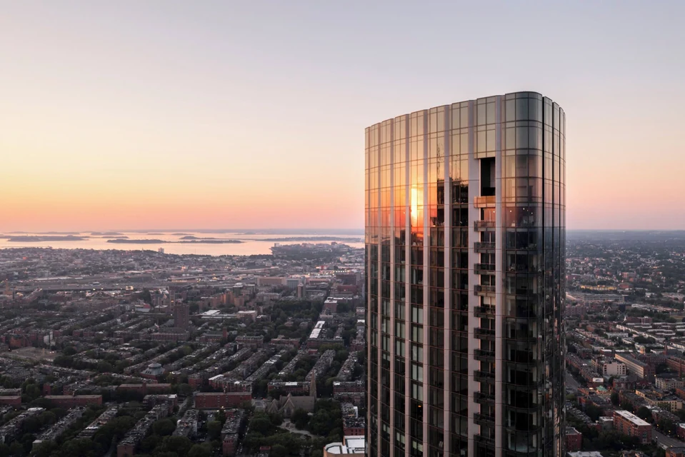 Four Seasons One Dalton Street glass tower over Back Bay at sunset via Expedia