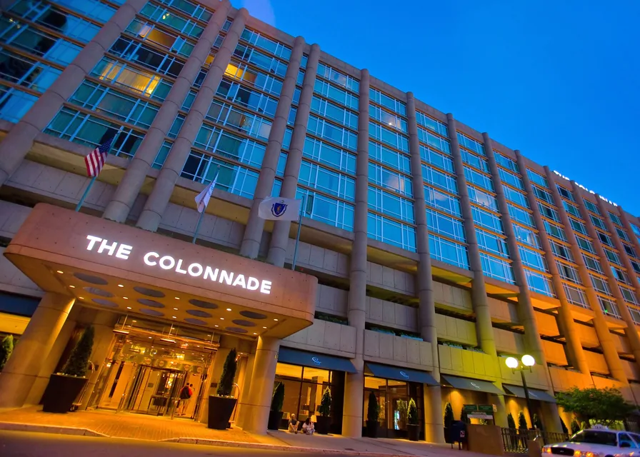The Colonnade Hotel entrance on Huntington Avenue at dusk via Expedia