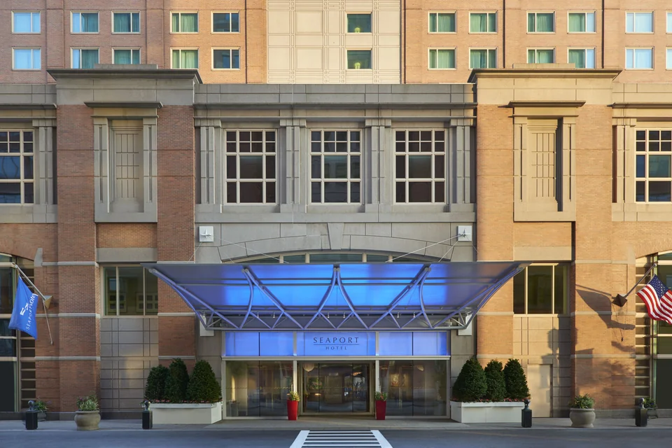 Seaport Hotel Boston entrance with blue canopy via Expedia