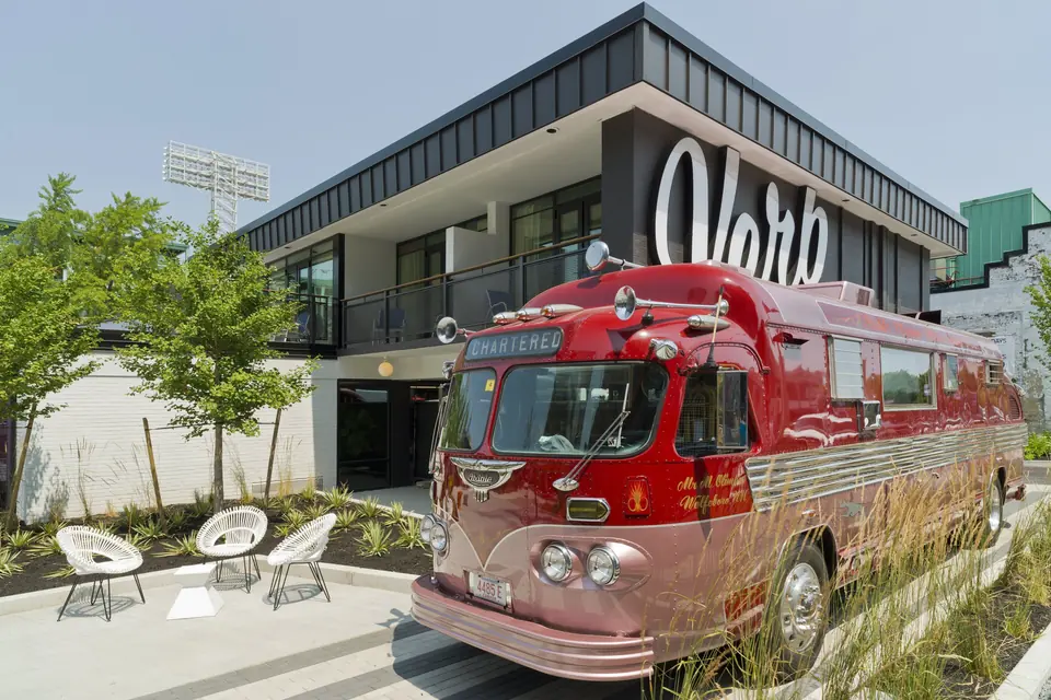 The Verb Hotel retro exterior with vintage tour bus via Expedia