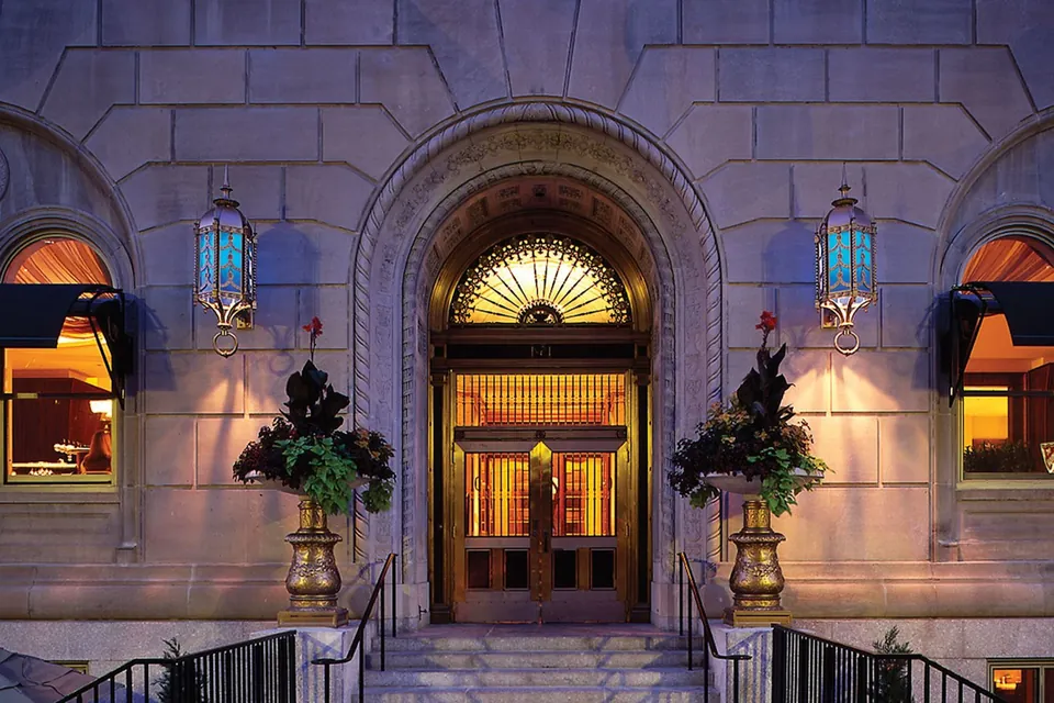 Hotel AKA Back Bay historic entrance at dusk via Expedia
